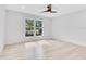 Bright bedroom with hardwood floors and large window at 1203 Waverly Way, Longwood, FL 32750