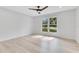 Bright bedroom with light wood floors and large window at 1203 Waverly Way, Longwood, FL 32750