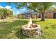 Stone fire pit in the backyard at 1203 Waverly Way, Longwood, FL 32750