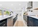 Modern kitchen with stainless steel appliances and marble countertops at 1203 Waverly Way, Longwood, FL 32750