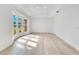 Spacious living room featuring light wood flooring and a large bay window at 1203 Waverly Way, Longwood, FL 32750