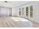 Living room with light wood floors, bay window, and plenty of natural light at 1203 Waverly Way, Longwood, FL 32750