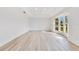 Living room with hardwood floors and a bay window, offering natural light at 1203 Waverly Way, Longwood, FL 32750