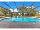 Enclosed pool area with water feature and brick pavers at 1203 Waverly Way, Longwood, FL 32750