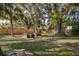 Spacious backyard with a stone patio and mature trees at 1222 Golfview St, Orlando, FL 32804