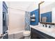 Well maintained bathroom with tiled walls, large vanity, and shower and tub combo at 1222 Golfview St, Orlando, FL 32804