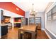 Open dining room next to the kitchen, featuring a wooden table and unique chandelier lighting at 1222 Golfview St, Orlando, FL 32804