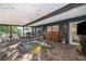 Covered outdoor patio with a hot tub and string lights at 1222 Golfview St, Orlando, FL 32804