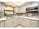 Modern kitchen with a stylish backsplash and lots of counter space at 127 Kaywood Dr, Sanford, FL 32771