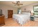 Spacious main bedroom with king-size bed and wood floors at 127 Kaywood Dr, Sanford, FL 32771