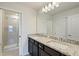 Bathroom with double vanity and granite top at 1274 Shoreside St, Clermont, FL 34714