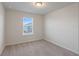 Bright bedroom with carpeted floor and window blinds at 1274 Shoreside St, Clermont, FL 34714