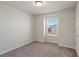 Simple bedroom with carpet, window, and double door closet at 1274 Shoreside St, Clermont, FL 34714