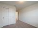 Spacious bedroom with double door closet and carpet at 1274 Shoreside St, Clermont, FL 34714