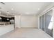 Bright living room with tile floors and sliding glass doors leading to a patio at 1274 Shoreside St, Clermont, FL 34714