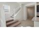 Modern white staircase with carpeted steps and access to upper level at 1274 Shoreside St, Clermont, FL 34714