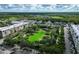 Aerial view of community with green space and townhouses at 12964 Brandon Coates Dr, Orlando, FL 32828