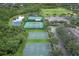 Aerial view of community tennis and basketball courts at 12964 Brandon Coates Dr, Orlando, FL 32828