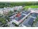 Aerial view of townhouses, showing location and ample parking at 12964 Brandon Coates Dr, Orlando, FL 32828