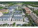 Aerial view showing townhouses, parking and landscape at 12964 Brandon Coates Dr, Orlando, FL 32828