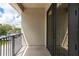 Private balcony offers a view of the parking lot and surrounding buildings at 12964 Brandon Coates Dr, Orlando, FL 32828