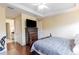 Spacious bedroom with hardwood floors and ensuite bathroom at 12964 Brandon Coates Dr, Orlando, FL 32828