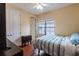 Charming bedroom with hardwood floors and window at 12964 Brandon Coates Dr, Orlando, FL 32828