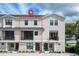 Two-story townhome with modern exterior and balcony at 12964 Brandon Coates Dr, Orlando, FL 32828
