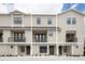 Three-unit townhome building with contemporary design at 12964 Brandon Coates Dr, Orlando, FL 32828