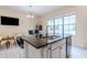 Eat-in kitchen with granite island and breakfast bar at 12964 Brandon Coates Dr, Orlando, FL 32828