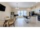 Modern kitchen with a breakfast bar and stainless steel appliances at 12964 Brandon Coates Dr, Orlando, FL 32828