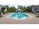 Community features a resort-style pool with plenty of lounge chairs at 12964 Brandon Coates Dr, Orlando, FL 32828