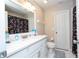 Clean bathroom with white vanity, toilet and shower at 13214 Meergate Cir, Orlando, FL 32837