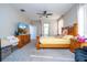 Primary bedroom with king bed, TV, and plenty of space at 13214 Meergate Cir, Orlando, FL 32837