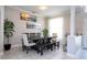 Dining room with dark wood table and light chairs at 13214 Meergate Cir, Orlando, FL 32837