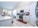 Modern kitchen featuring white cabinets and stainless steel appliances at 13214 Meergate Cir, Orlando, FL 32837