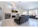 Living room with a fireplace and built-in shelving at 13214 Meergate Cir, Orlando, FL 32837