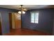 Bedroom with hardwood floors and window at 1425 N Hiawassee Rd, Orlando, FL 32818