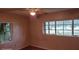 Bright bedroom with wood floors and multiple windows at 1425 N Hiawassee Rd, Orlando, FL 32818