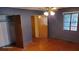 Bright bedroom with hardwood floors and neutral walls at 1425 N Hiawassee Rd, Orlando, FL 32818