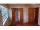 Bedroom with wood floors, closet and window at 1425 N Hiawassee Rd, Orlando, FL 32818