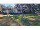 House with mature trees and yard at 1425 N Hiawassee Rd, Orlando, FL 32818