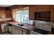 Kitchen with wood cabinets and tile countertops at 1425 N Hiawassee Rd, Orlando, FL 32818