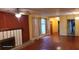 Spacious living room with hardwood floors and a fireplace at 1425 N Hiawassee Rd, Orlando, FL 32818