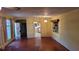 Living room with hardwood floors and view of kitchen at 1425 N Hiawassee Rd, Orlando, FL 32818