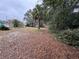 Vacant lot near pool, featuring mature trees and privacy at 1425 N Hiawassee Rd, Orlando, FL 32818