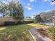 Landscaped backyard with brick pathway at 1470 Place Picardy, Winter Park, FL 32789