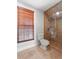 Bathroom with shower, toilet and window at 1470 Place Picardy, Winter Park, FL 32789