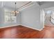 Formal dining room featuring hardwood floors and a chandelier at 1470 Place Picardy, Winter Park, FL 32789