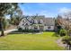 Two-story house with white exterior, gray roof, and landscaped lawn at 1470 Place Picardy, Winter Park, FL 32789